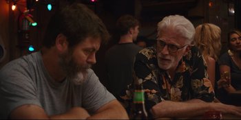 Movie still from “Hearts Beat Loud” (2018), directed by Brett Haley – Two men sitting at a table with a bottle of beer in front of them; Medium shot, Over the shoulder angle