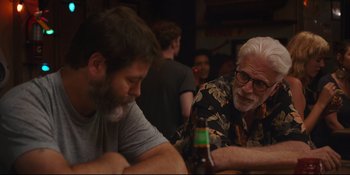 Movie still from “Hearts Beat Loud” (2018), directed by Brett Haley – Two men sitting at a table with a bottle of beer in front of them; Medium shot, Over the shoulder angle