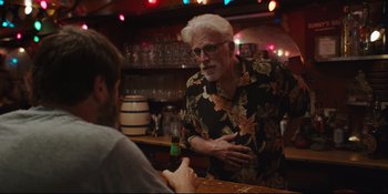 Movie still from “Hearts Beat Loud” (2018), directed by Brett Haley – An older man standing at a bar talking to a young man; Medium shot, Over the shoulder angle