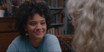 Movie still from “Hearts Beat Loud” (2018), directed by Brett Haley – A woman sitting in front of another woman in front of a book shelf; Close Up shot, Over the shoulder angle