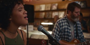 Movie still from “Hearts Beat Loud” (2018), directed by Brett Haley – A woman holding a microphone in front of a man; Medium shot, Over the shoulder angle