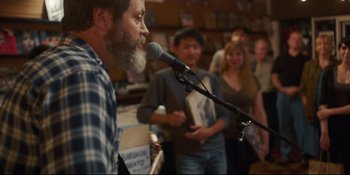 Movie still from “Hearts Beat Loud” (2018), directed by Brett Haley – A man with a beard is speaking into a microphone; Close Up shot, Over the shoulder angle