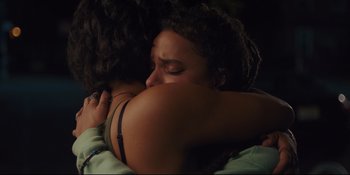 Movie still from “Hearts Beat Loud” (2018), directed by Brett Haley – Two women hugging each other in a dark room; Close Up shot, Over the shoulder angle