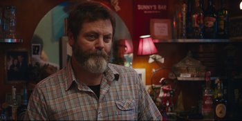 Movie still from “Hearts Beat Loud” (2018), directed by Brett Haley – Nick offerman in a plaid shirt in front of a red lamp; Close Up shot, Over the shoulder angle