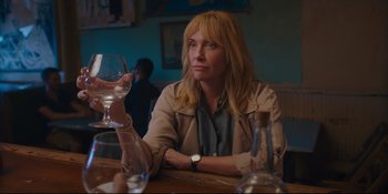 Movie still from “Hearts Beat Loud” (2018), directed by Brett Haley – A woman sitting at a table holding a wine glass; Close Up shot, Over the shoulder angle