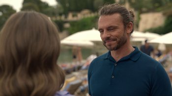 Movie still from “Emily in Paris” (2020), created by Darren Star – A person talking to another person; Close Up shot, Over the shoulder angle