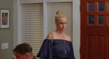 Movie still from “Heaven's Date” (2022), directed by Stevie Fernandez – A woman with blonde hair is wearing a blue dress; Medium shot, Over the shoulder angle