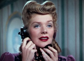 Movie still from “Hello Frisco, Hello” (1943), directed by H. Bruce Humberstone – An old fashioned woman talking on a phone; Close Up shot, Low angle