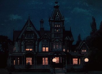 Movie still from “Hello Frisco, Hello” (1943), directed by H. Bruce Humberstone – A large house with a lot of windows lit up at night; Extreme Wide shot, Low angle