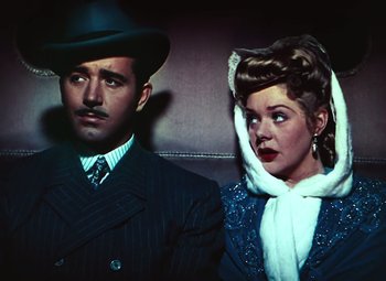 Movie still from “Hello Frisco, Hello” (1943), directed by H. Bruce Humberstone – A man and a woman sitting next to each other; Close Up shot, Low angle