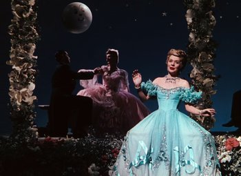 Movie still from “Hello Frisco, Hello” (1943), directed by H. Bruce Humberstone – A group of people dressed up in costumes; Wide shot, Low angle