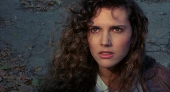 Movie still from “Hellraiser” (1987), directed by Clive Barker – A person with curly hair; Close Up shot, High angle