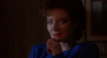 Movie still from “Hellraiser” (1987), directed by Clive Barker – A person wearing a blue shirt; Close Up shot, Over the shoulder angle