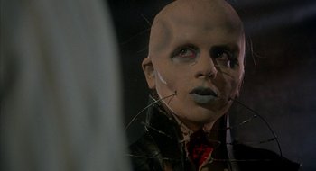 Movie still from “Hellraiser” (1987), directed by Clive Barker – The face of a man with a bald head; Close Up shot, Low angle