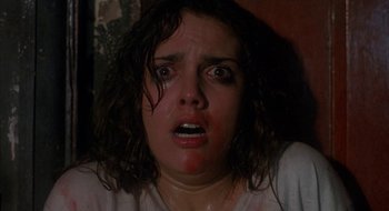 Movie still from “Hellraiser” (1987), directed by Clive Barker – A person with a face covered in blood; Close Up shot, Low angle