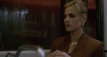 Movie still from “Hellraiser III: Hell on Earth” (1992), directed by Anthony Hickox – A woman sitting on a train looking out the window; Close Up shot, Over the shoulder angle