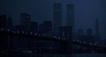 Movie still from “Hellraiser III: Hell on Earth” (1992), directed by Anthony Hickox – A view of a bridge and a city skyline at night time; Extreme Wide shot, Low angle
