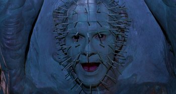 Movie still from “Hellraiser III: Hell on Earth” (1992), directed by Anthony Hickox – The face of a man in a pinhead mask; Close Up shot, Overhead angle