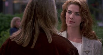 Movie still from “Hellraiser III: Hell on Earth” (1992), directed by Anthony Hickox – Two women are talking to each other in a park; Close Up shot, Over the shoulder angle