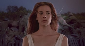 Movie still from “Hellraiser III: Hell on Earth” (1992), directed by Anthony Hickox – A woman in a white top is looking at the camera; Close Up shot, Low angle