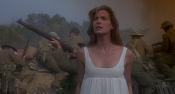 Movie still from “Hellraiser III: Hell on Earth” (1992), directed by Anthony Hickox – A woman in a white dress standing in front of a painting; Medium shot, Low angle
