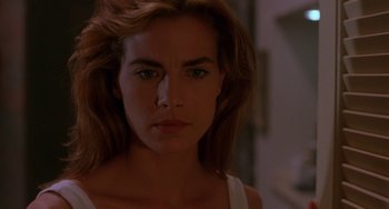 Movie still from “Hellraiser III: Hell on Earth” (1992), directed by Anthony Hickox – A person with long hair; Close Up shot, Over the shoulder angle