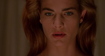 Movie still from “Hellraiser III: Hell on Earth” (1992), directed by Anthony Hickox – A woman's face with green eyes; Close Up shot, Low angle