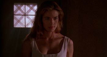 Movie still from “Hellraiser III: Hell on Earth” (1992), directed by Anthony Hickox – A beautiful woman with long hair in a white dress; Close Up shot, Low angle
