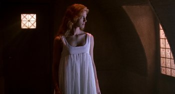 Movie still from “Hellraiser III: Hell on Earth” (1992), directed by Anthony Hickox – A beautiful young lady in a long white dress; Medium shot, Low angle