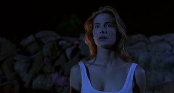 Movie still from “Hellraiser III: Hell on Earth” (1992), directed by Anthony Hickox – A woman in a white tank top looking up at the sky; Close Up shot, Low angle