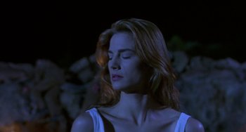 Movie still from “Hellraiser III: Hell on Earth” (1992), directed by Anthony Hickox – A beautiful woman with red hair and a white top; Close Up shot, Low angle