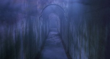 Movie still from “Hellraiser III: Hell on Earth” (1992), directed by Anthony Hickox – A dark hallway with a large arch in the middle; Extreme Wide shot, High angle
