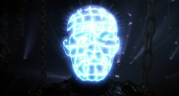 Movie still from “Hellraiser III: Hell on Earth” (1992), directed by Anthony Hickox – A glowing head is lit up with blue lights; Close Up shot, Low angle