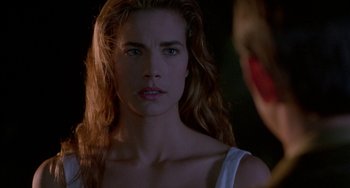 Movie still from “Hellraiser III: Hell on Earth” (1992), directed by Anthony Hickox – A person with long brown hair; Close Up shot, Over the shoulder angle