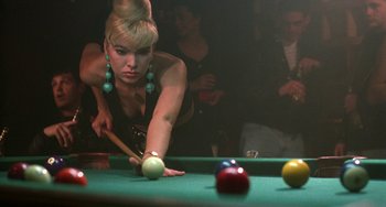 Movie still from “Hellraiser III: Hell on Earth” (1992), directed by Anthony Hickox – A woman is playing a game of billiards on a pool table; Close Up shot, Over the shoulder angle