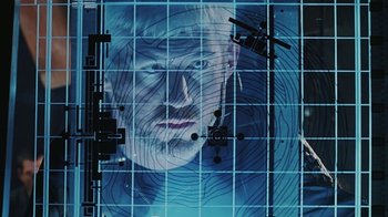 Movie still from “Hellraiser: Bloodline” (1996), directed by Kevin Yagher – A picture of a man's face on a computer screen; Extreme Close Up shot, Overhead angle