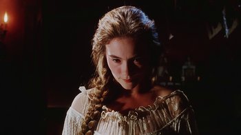 Movie still from “Hellraiser: Bloodline” (1996), directed by Kevin Yagher – A woman with long hair is wearing a white dress; Close Up shot, Low angle