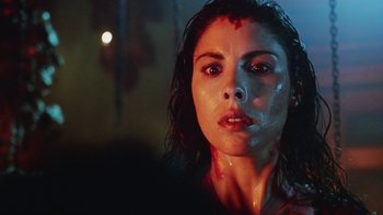 Movie still from “Hellraiser: Bloodline” (1996), directed by Kevin Yagher – A person with blood on their face; Close Up shot, Low angle