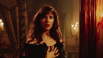 Movie still from “Hellraiser: Bloodline” (1996), directed by Kevin Yagher – A beautiful woman with long hair standing next to a wall; Close Up shot, Low angle