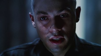 Movie still from “Hellraiser: Bloodline” (1996), directed by Kevin Yagher – A man's face in the dark; Close Up shot, Low angle