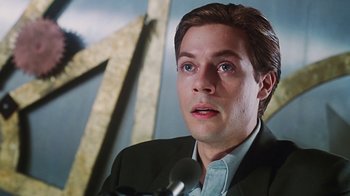 Movie still from “Hellraiser: Bloodline” (1996), directed by Kevin Yagher – A person wearing a suit and tie; Close Up shot, Low angle