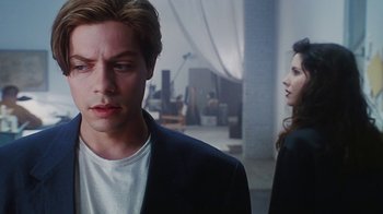 Movie still from “Hellraiser: Bloodline” (1996), directed by Kevin Yagher – A man and a woman standing next to each other in a room; Close Up shot, Over the shoulder angle