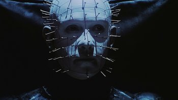 Movie still from “Hellraiser: Bloodline” (1996), directed by Kevin Yagher – A person with a face covered in needles; Close Up shot, Low angle