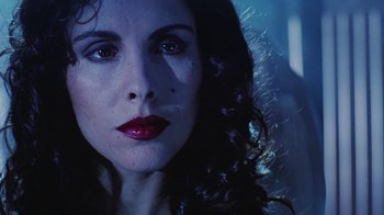 Movie still from “Hellraiser: Bloodline” (1996), directed by Kevin Yagher – A person with long dark hair; Close Up shot, Low angle