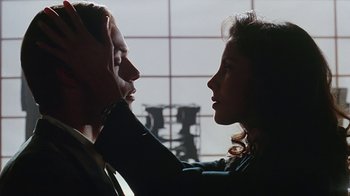 Movie still from “Hellraiser: Bloodline” (1996), directed by Kevin Yagher – A man and a woman face to face in front of a window; Close Up shot, Over the shoulder angle