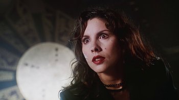 Movie still from “Hellraiser: Bloodline” (1996), directed by Kevin Yagher – A person wearing a black jacket; Close Up shot, Low angle