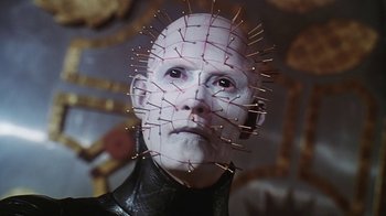 Movie still from “Hellraiser: Bloodline” (1996), directed by Kevin Yagher – A man with a face covered in needles; Close Up shot, Low angle
