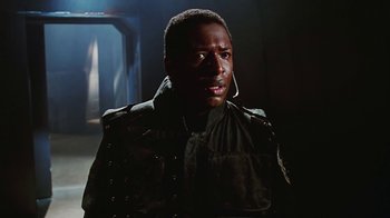 Movie still from “Hellraiser: Bloodline” (1996), directed by Kevin Yagher – A person wearing a jacket; Close Up shot, Low angle