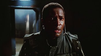 Movie still from “Hellraiser: Bloodline” (1996), directed by Kevin Yagher – A person wearing a jacket; Close Up shot, Low angle