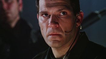 Movie still from “Hellraiser: Bloodline” (1996), directed by Kevin Yagher – A person wearing a headset; Close Up shot, Low angle